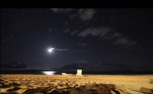 Maui moon over beach at night