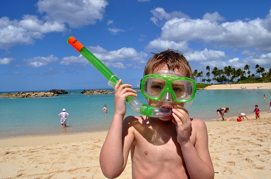 Boy with snorkeling mask, snorkel, in Hawaii