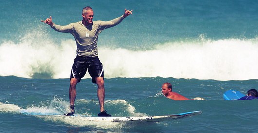 Surfer Catching Wave on Surfboard - Hawaii