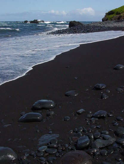 This is a black sand beach located close to Hana, Maui.