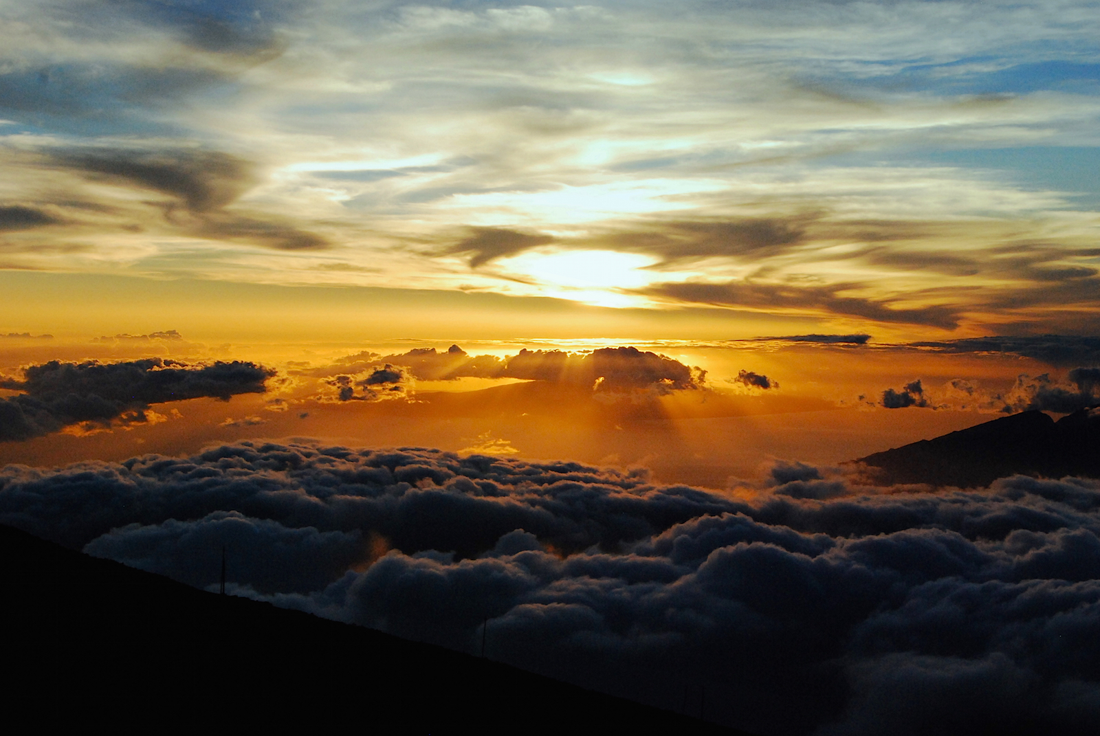 Sunset as viewed from summit of Haleakala Volcano, Maui, Hawaii