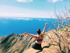 Girl on top of mountain