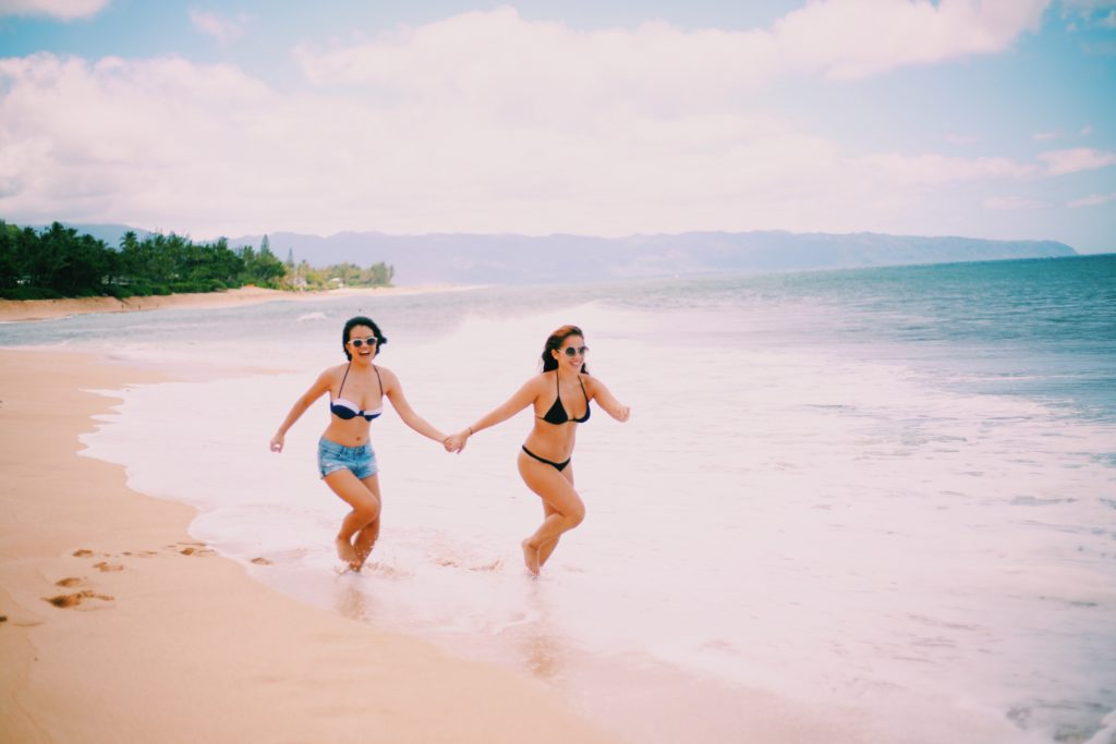 girls running on the beach