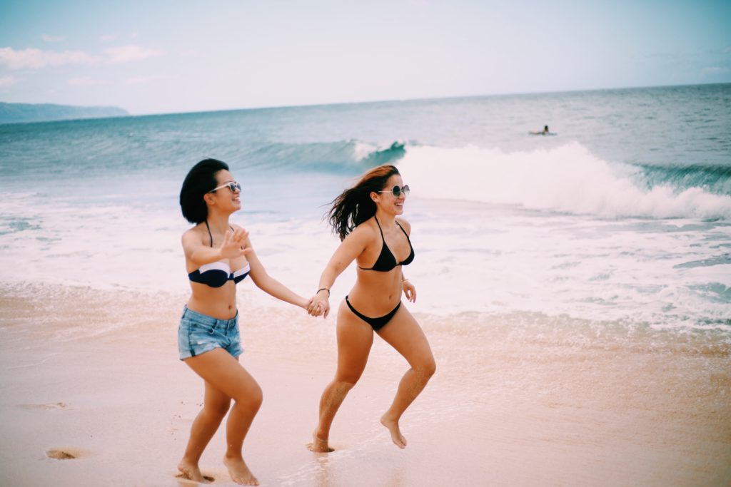 girls running on beach