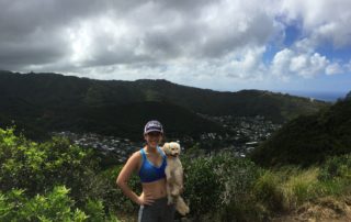 Girl with dog on Waahila Ridge Hike