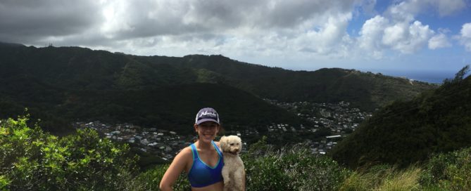Girl with dog on Waahila Ridge Hike