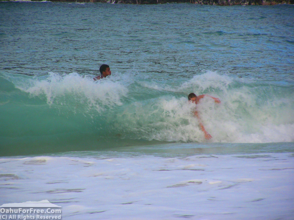 Bodysurfer catching a wave at Makapuu beach