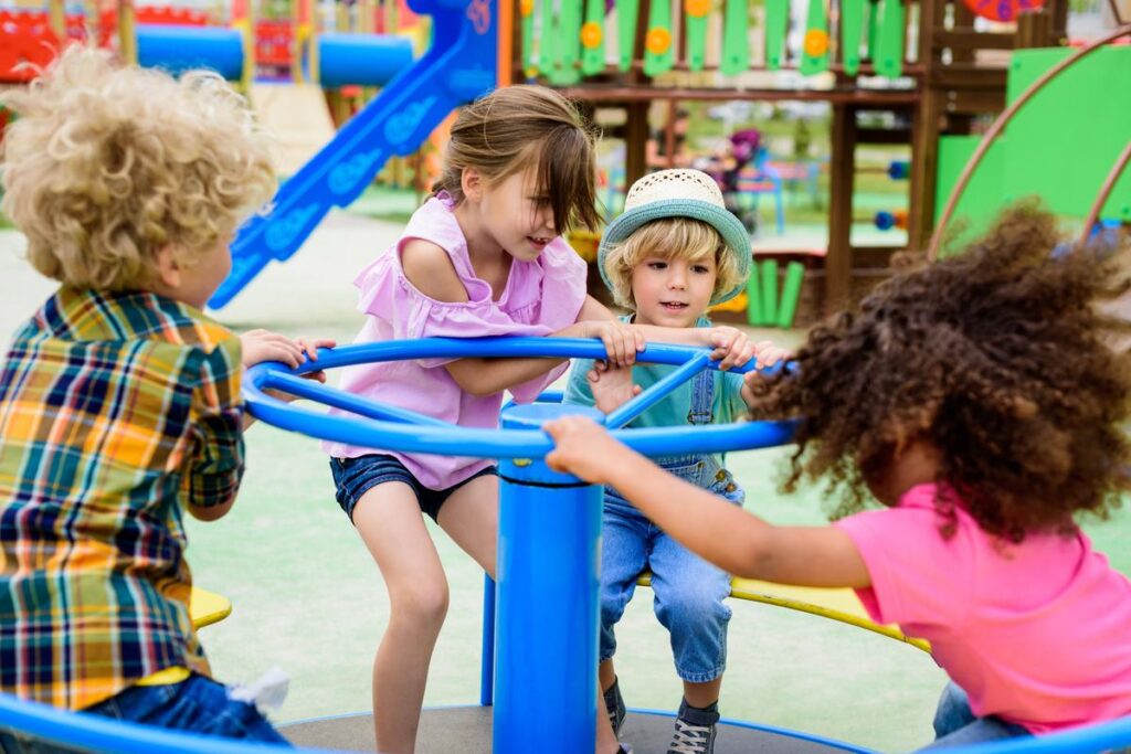 children playing on carousel