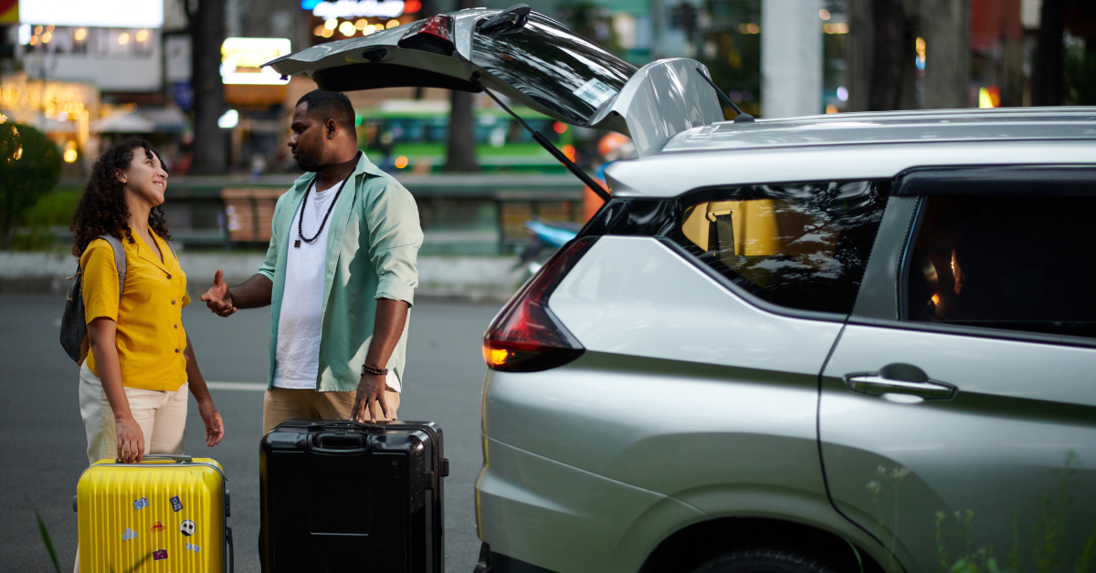 young couple returning their rental car