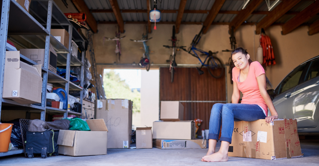 girl sitting in garage during a clean up
